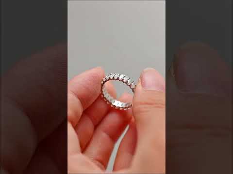 Shop a timeless oval cut moissanite full eternity band with brilliant prong-set stones. Perfect wedding, anniversary, or stacking ring.
