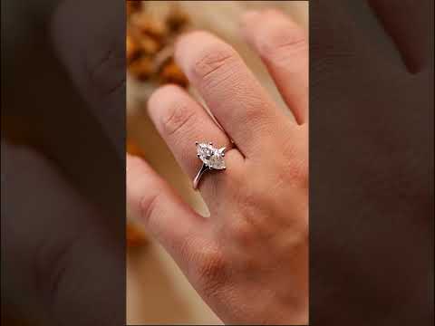 Classic marquise cut moissanite diamond solitaire engagement ring in solid gold. Prong-set brilliance, timeless design, perfect for proposals.