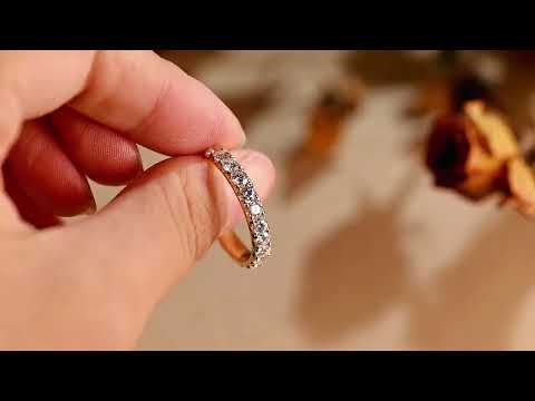Round-cut moissanite eternity band with shared-prong setting. solid gold wedding or anniversary ring offering luxurious brilliance and timeless elegance.