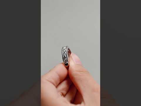 Elegant channel-set round cut moissanite wedding band in solid gold. A modern, durable eternity ring perfect for weddings, anniversaries, and daily wear.