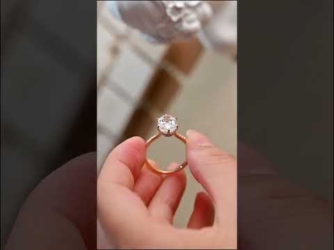 Oval cut moissanite ring with hidden halo, prong-set diamonds, and a half eternity pave band. engagement or anniversary ring crafted for luxurious sparkle.