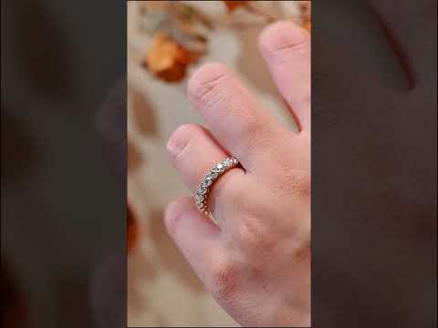 Full eternity round cut moissanite diamond band ring in solid gold. A timeless wedding, anniversary, or stacking ring with continuous sparkle.