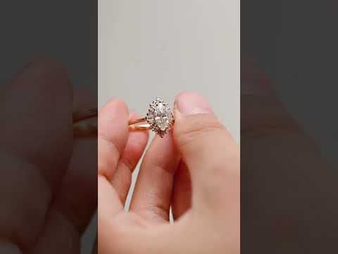 Marquise cut moissanite halo ring with baguette and round diamonds, handcrafted in solid gold. A vintage-inspired engagement ring with timeless sparkle.