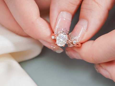 Nature-inspired three stone oval moissanite engagement ring with vine rose gold band. bridal ring perfect for proposals, anniversaries, and romantic gifts.