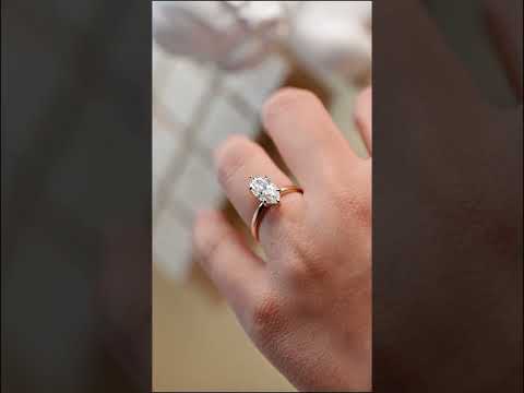 Elegant marquise cut moissanite solitaire ring with hidden halo and straight shank, prong-set handcrafted in solid gold for timeless engagement beauty.