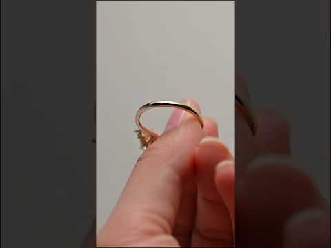 oval cut moissanite engagement ring with pear side stones and a cluster accent design. three-stone bridal ring, timeless beauty for proposals and anniversaries.