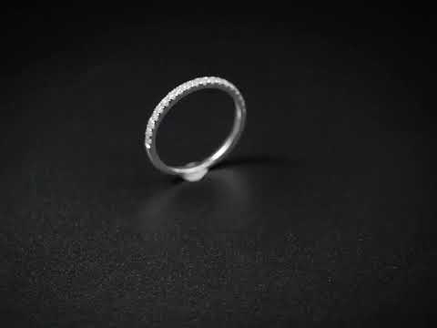 Shop a classic round cut moissanite half eternity wedding band in solid gold. A slim, stackable ring perfect for weddings, anniversaries, or daily elegance.