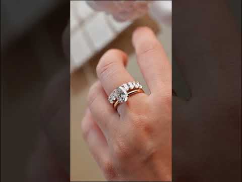 Oval cut moissanite solitaire engagement ring with matching oval eternity wedding band in solid gold, a timeless and elegant classic bridal ring set.