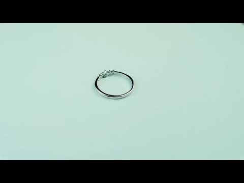 Vintage wedding band featuring round cut moissanite diamond accents in solid gold. A delicate, timeless bridal ring perfect for stacking or wearing alone.