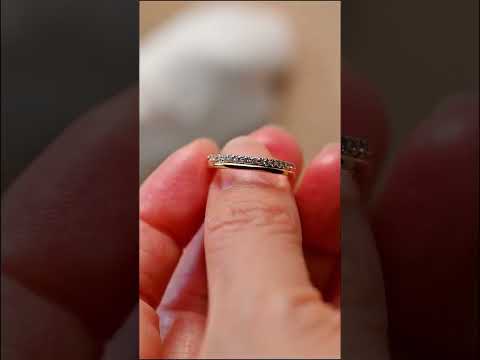 Round-cut moissanite half eternity band in solid gold. Dainty pave sparkle, perfect as a wedding band, stacking ring, or timeless anniversary gift.