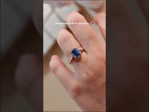 Royal blue emerald cut cubic zirconia diamond halo engagement ring with matching diamond half eternity wedding band in solid gold, vintage inspired bridal ring set.