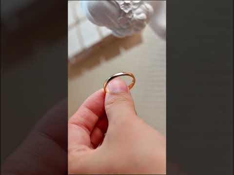 Classic solid gold wedding band featuring a polished finish and comfort-fit design. Perfect for men or women seeking elegant, and durable everyday ring.