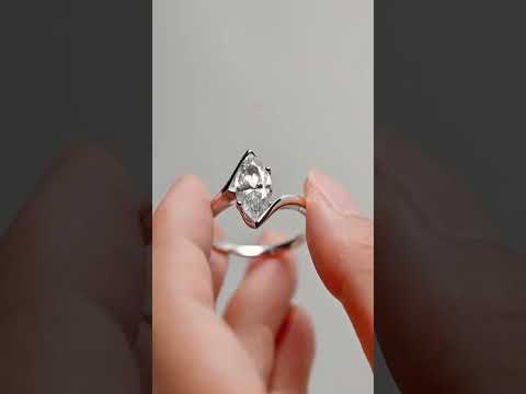 Modern marquise cut moissanite solitaire with bypass shank tension setting ring. A minimalist white gold engagement ring with timeless brilliance.
