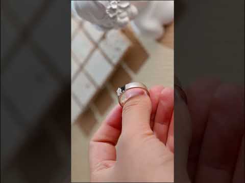 Emerald-cut moissanite band ring with a refined claw prong setting. solid gold wedding or engagement ring offering sleek elegance and brilliant sparkle.