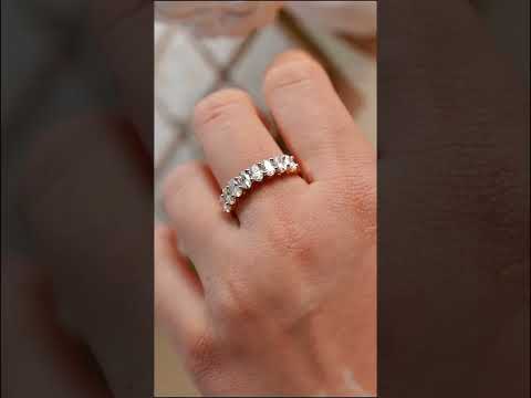 Elegant oval cut moissanite half eternity band ring in solid gold, perfect for weddings, anniversaries, stacking, and timeless everyday luxury.
