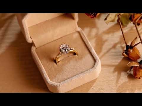 Oval cut moissanite diamond halo bridal ring set with matching diamond band in solid gold, a timeless ethical engagement and wedding ring set for her.