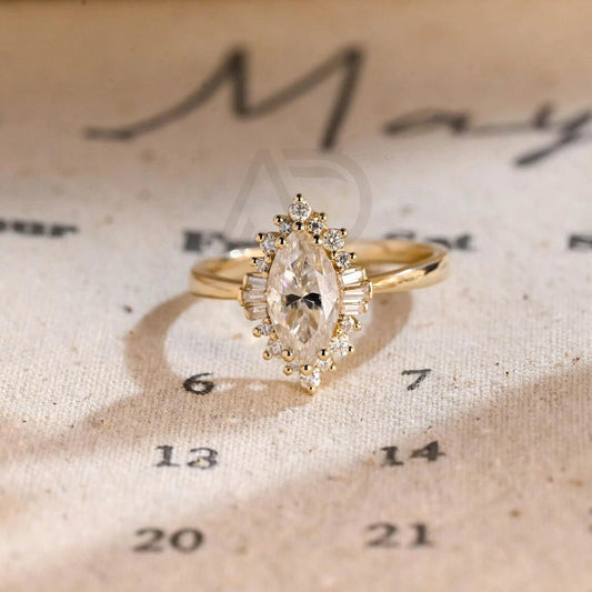 Avittam Diamond Jewels Starburst Marquise Moissanite Engagement Ring with gold band and sparkling stones