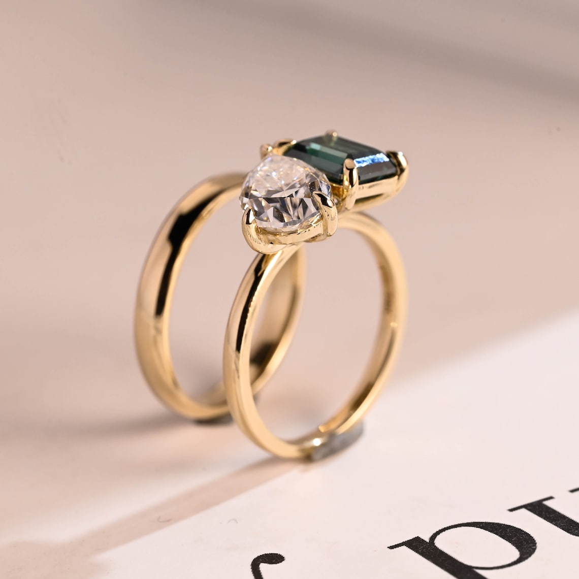 Green emerald and pear diamond ring