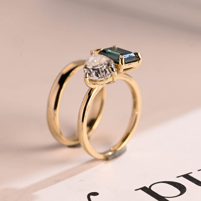 Green emerald and pear diamond ring