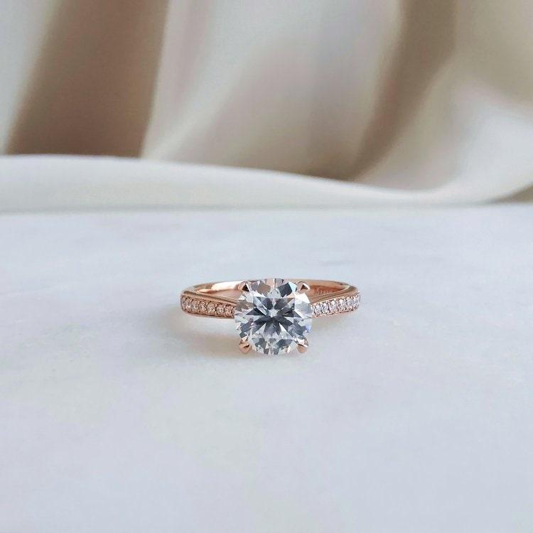 Here are additional SEO tags for your title:  Round moissanite engagement ring, Solitaire promise ring, Classic 4 prongs ring, 14K yellow gold promise ring, Personalized gift, Moissanite solitaire ring, Yellow gold engagement ring, Customizable promise ring, Romantic promise ring, Timeless engagement ring