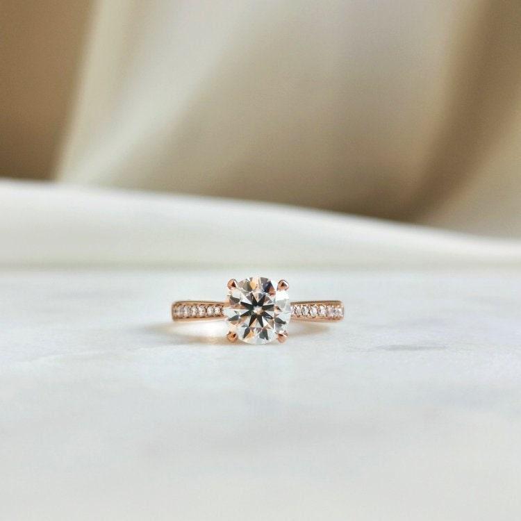 Here are additional SEO tags for your title:  Round moissanite engagement ring, Solitaire promise ring, Classic 4 prongs ring, 14K yellow gold promise ring, Personalized gift, Moissanite solitaire ring, Yellow gold engagement ring, Customizable promise ring, Romantic promise ring, Timeless engagement ring